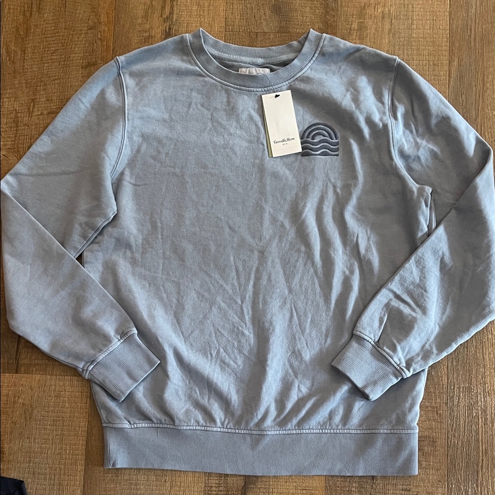 Light Blue Crewneck Sweatshirt with Subtle Wave Logo